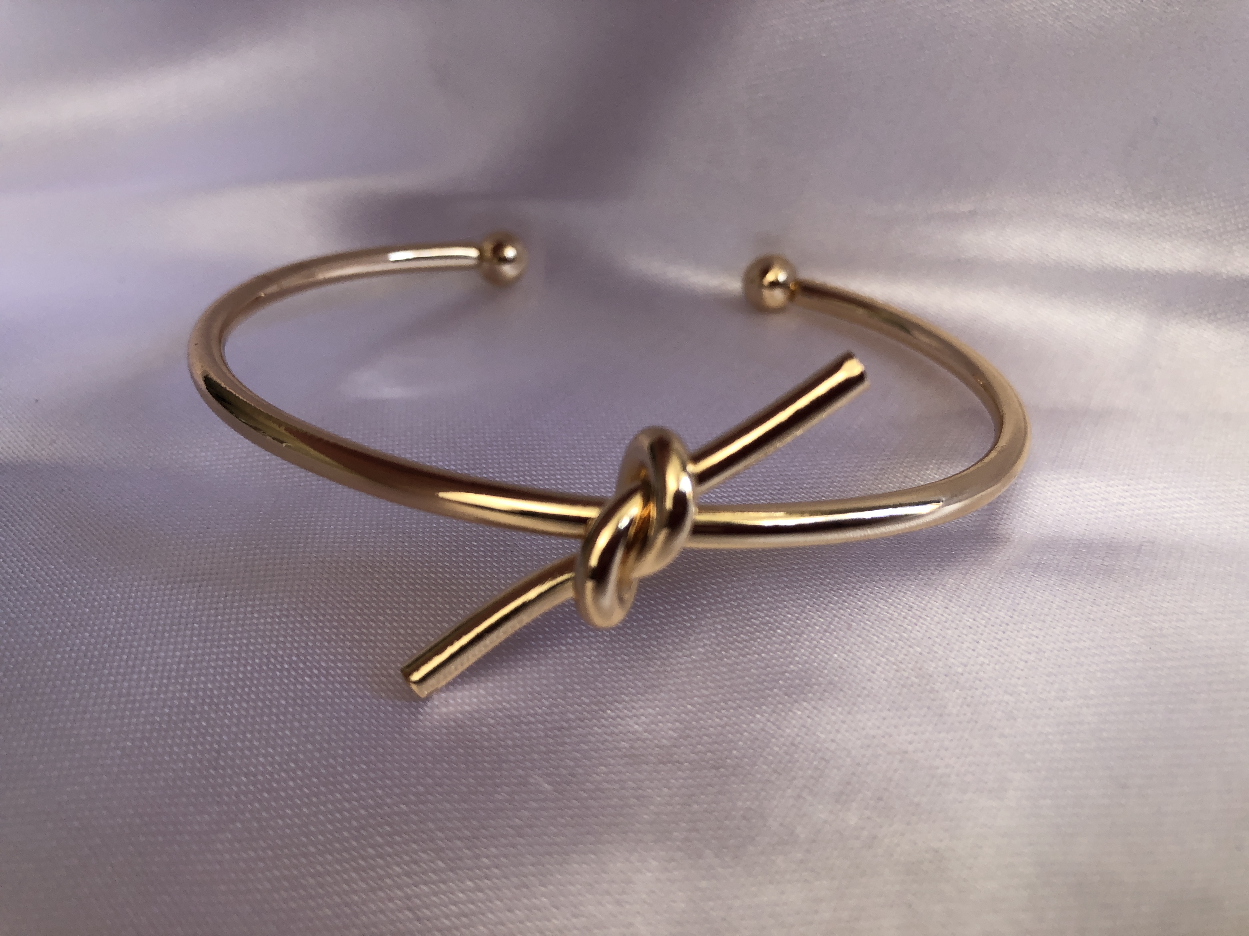 بنگل رادیوم مدل گره ای طلایی زنانه